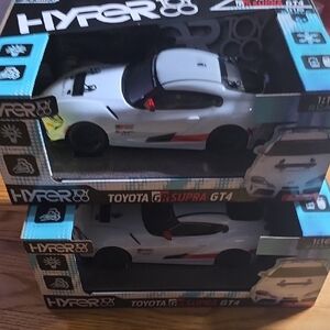 2 White and Black Toyota GR Supra GT4 Remote Control Cars
